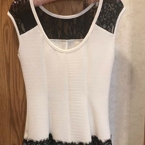 White shirt with black lace shoulders and bottom.